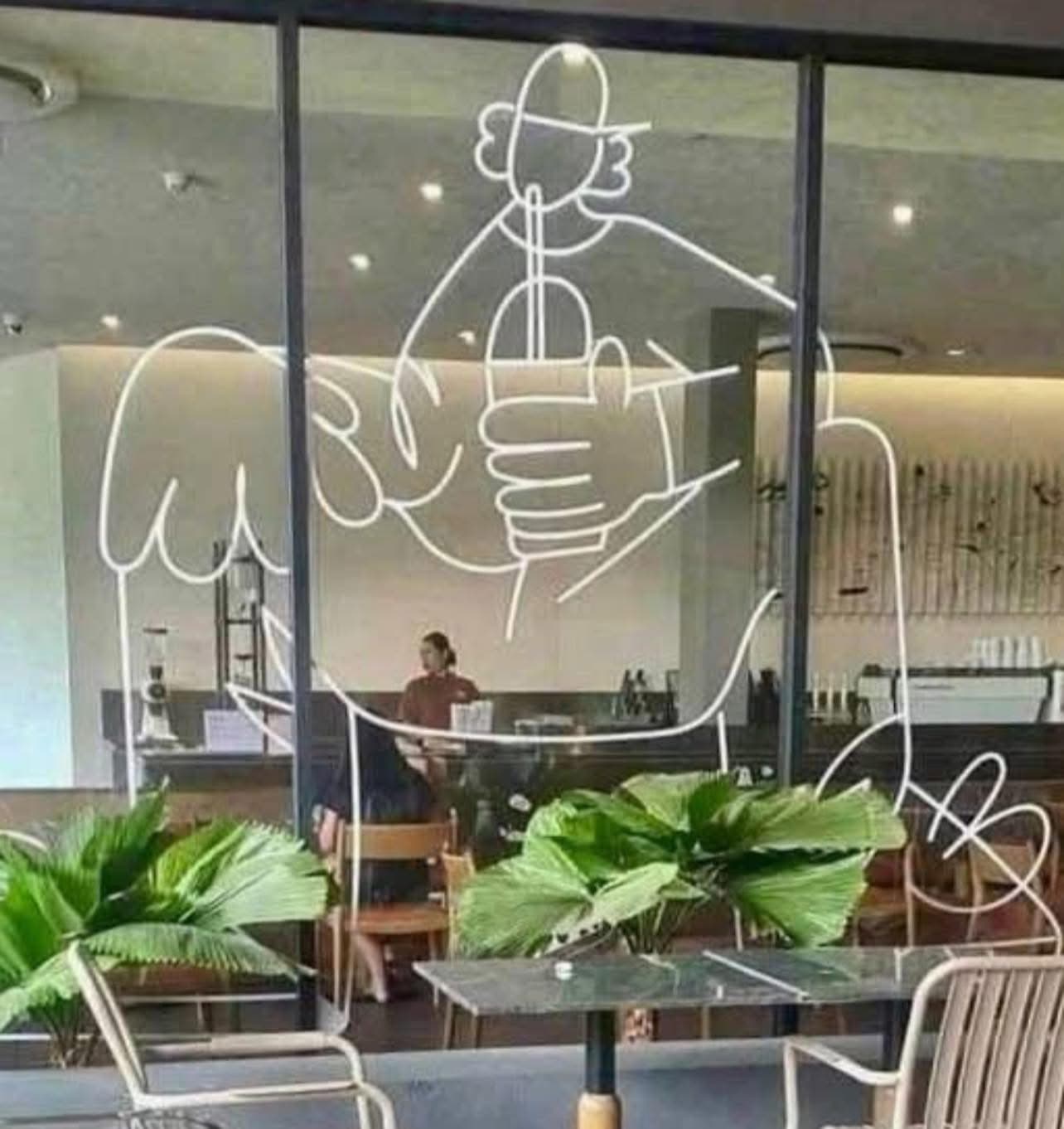 Vraiment, ils n'ont pas pensé regarder cette image avant de la mettre sur le mur... un ado qui bois assis mais on dirais un ado qui se tiens le pénis